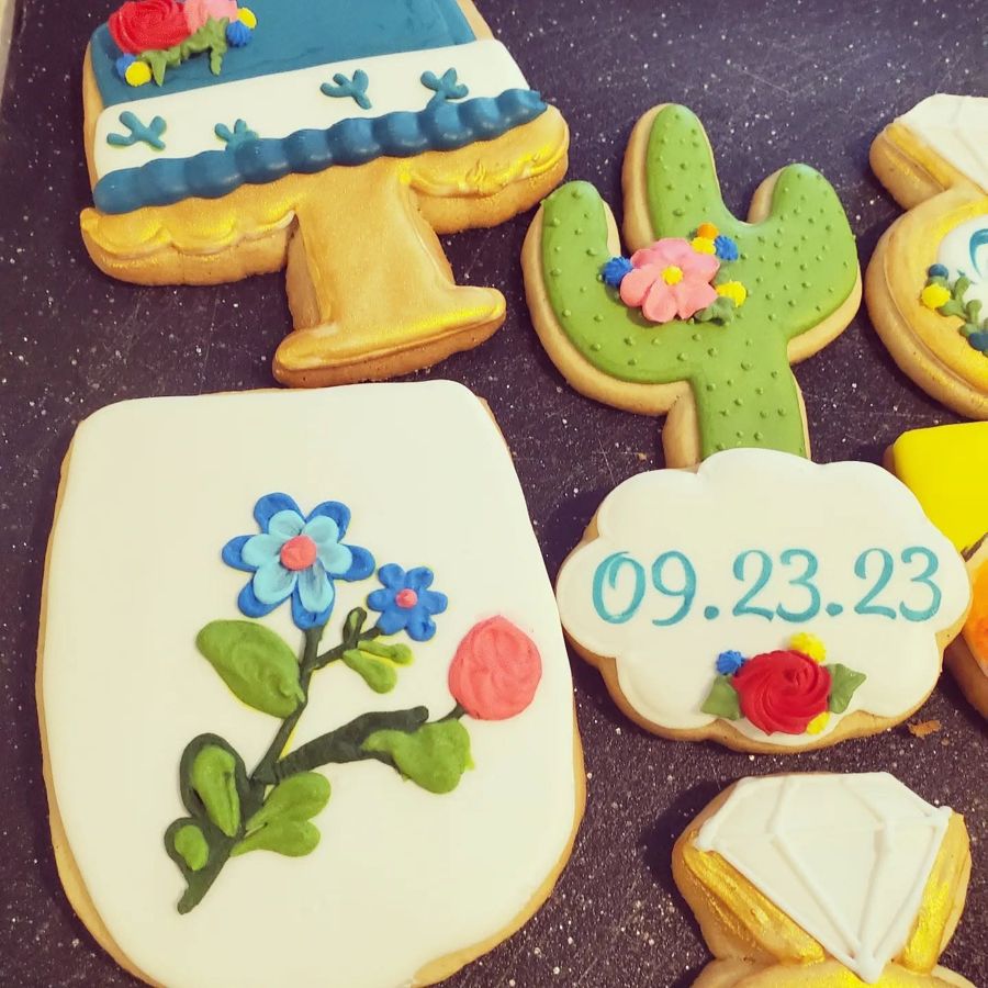 Bridal shower cookies with a wedding date, cactus, diamond ring and flowers