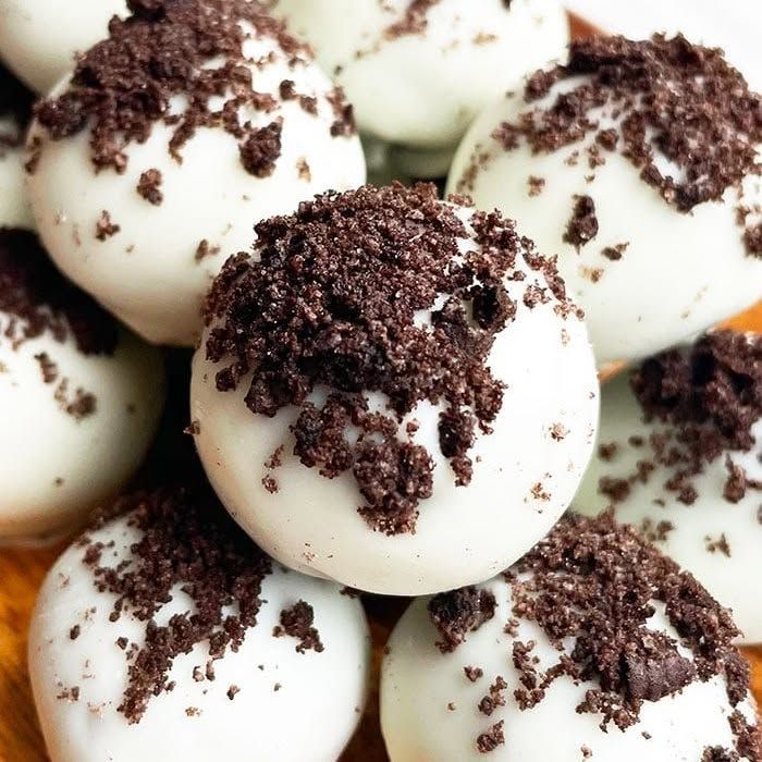 White chocolate cookies and cream truffles topped with cookie crumbs