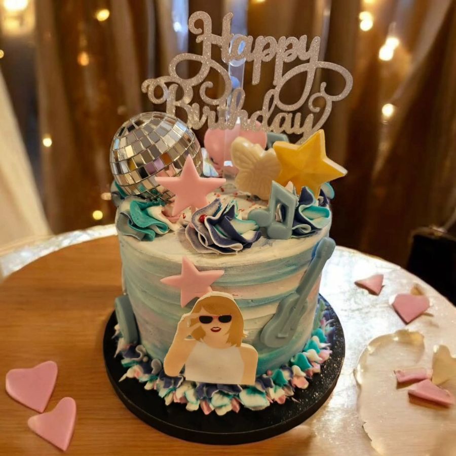 Pop star birthday cake with a disco ball, guitar and stars