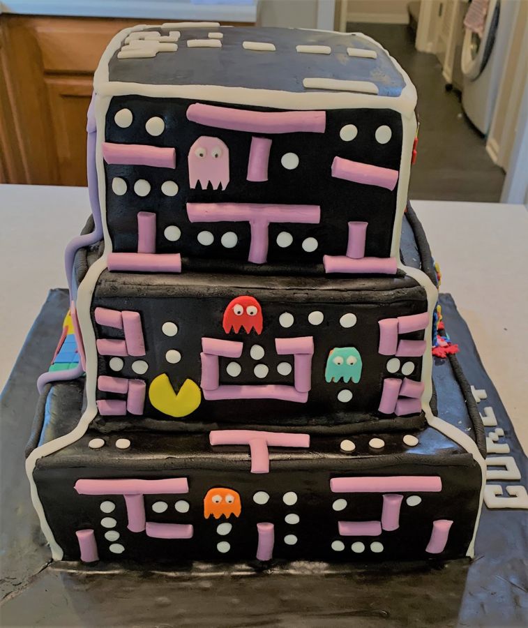 Three-tier Pac-Man arcade cake with ghosts and maze