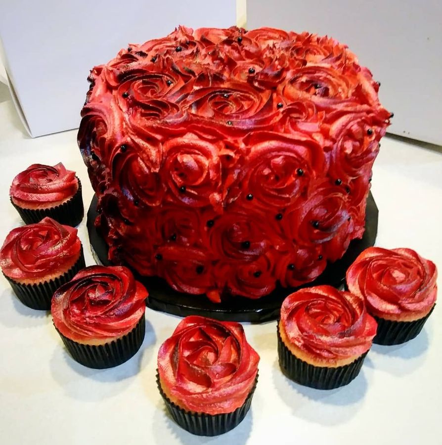 Red buttercream rosette cake with matching rose cupcakes