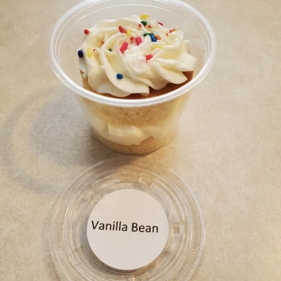Vanilla bean cake cup with buttercream and rainbow sprinkles