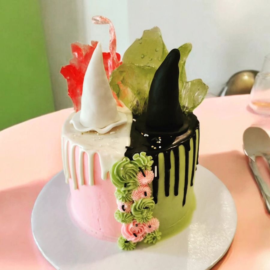 Half pink, half green witch hat cake with sugar glass shards